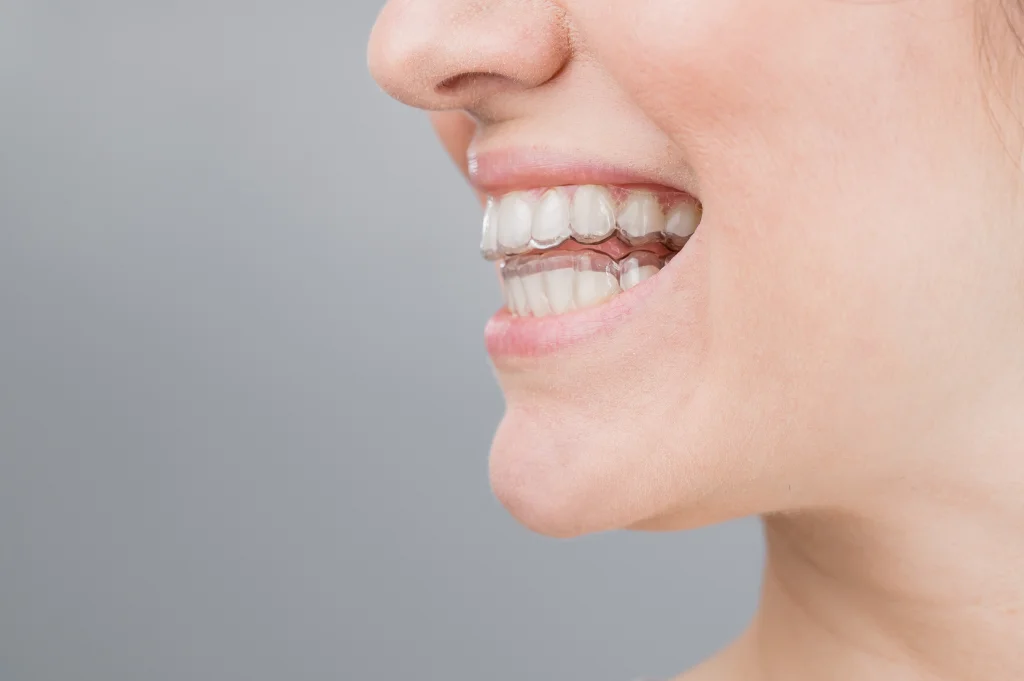 close-up-woman-wearing-mask-against-white-background